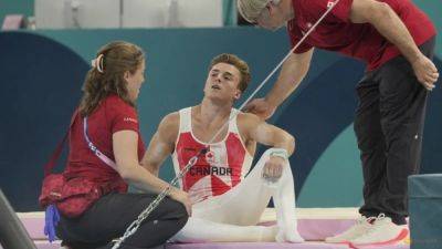 Gymnastics-Canada's Dolci gets do over on bar after equipment malfunction