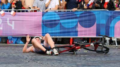 Paris streets littered by bicycle crashes during Olympics triathlon amid wet conditions