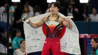 Japan's Shinnosuke Oka wins men's all-around gymnastics gold - ESPN