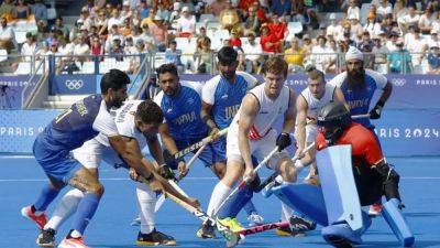 Hockey-Belgium beat India to stay top, Britain, Argentina advance