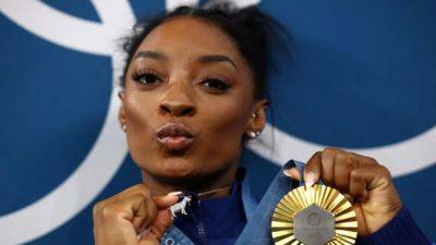 Simone Biles - Paris Olympics - Rebeca Andrade - Gymnastics-Biles stands head and shoulders above rivals after clinching all-around gold - channelnewsasia.com - Brazil - Usa - state Texas