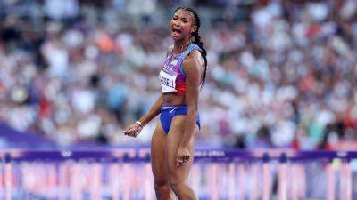 American Masai Russell wins women's Olympic 100m hurdles gold - ESPN