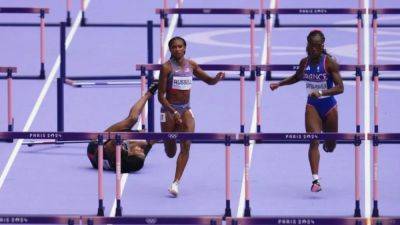 American Russell takes 100m hurdles gold by a whisker