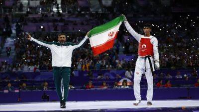 Taekwondo-Iran's Salimi wins men's heavyweight gold