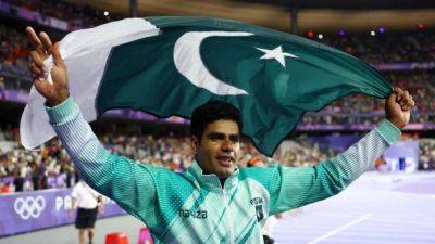 Gold medallist Nadeem brings Pakistan's first medal home to hero's welcome