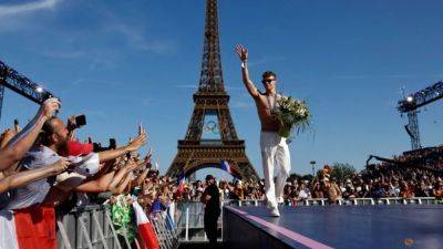 Les Bleus - Emmanuel Macron - Paris Olympics - Paris Games - Amelie Oudea-Castera - Leon Marchand - France live up to expectations with best medal haul in over a century at Paris Games - channelnewsasia.com - France