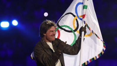 Simone Biles - Tom Cruise leaps from Stade de France, assists in LA '28 Hollywood logo reveal - ESPN - espn.com - France - Usa - Los Angeles