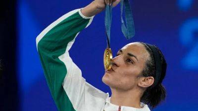 Elon Musk - Paris Olympics - She won boxing gold. Now Imane Khelif has filed a harassment complaint over claims she's a man and transgender - cbc.ca - France - Italy - Algeria