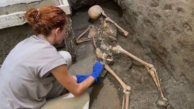 Pompeii archaeologists uncover tragic final moments of two victims of Mount Vesuvius eruption