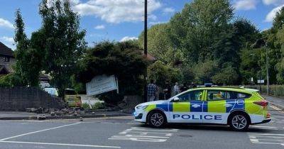 Police car ploughs through wall at funeral directors while responding to 999 call as officer rushed to hospital