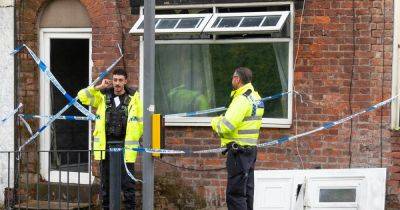 Trafford Centre - Police guard house after emergency services swarm road near Trafford Centre - manchestereveningnews.co.uk