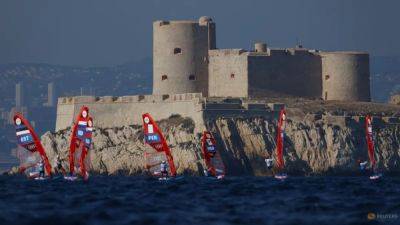 Sailing-Windsurfing medal-deciding races postponed to Saturday