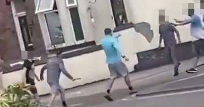 Street brawl video appears to show men brandishing weapons - including knife - as police launch investigation - manchestereveningnews.co.uk