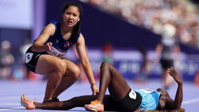 Laotian Olympic sprinter finishes race, turns back to help opponent who collapsed during women’s 100 prelim