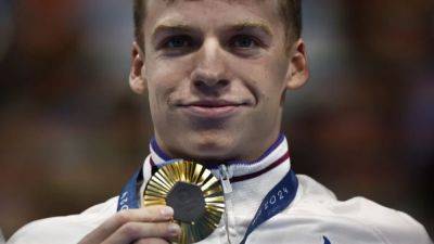 Magical Marchand takes fourth gold in Paris pool