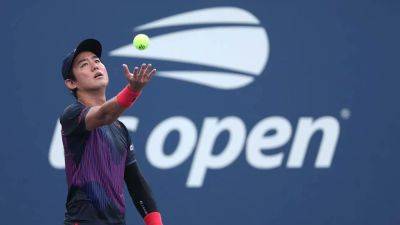 Japanese tennis star Yoshihito Nishioka collapses on court, exits in wheelchair during US Open match