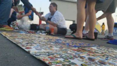 Pin trading fan from North Bay is having fun with his hobby while volunteering at the Olympics