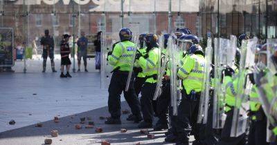 Police officers injured after violent protests take place in cities across UK