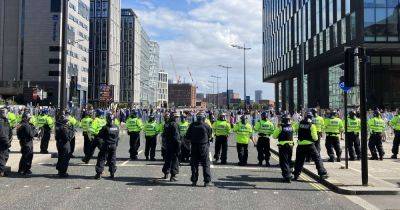 Police officers taken to hospital and shops looted after violence erupts in Liverpool