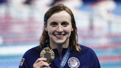 Katie Ledecky - Summer Macintosh - Leon Marchand - Ledecky takes record ninth gold as Summer sparkles - channelnewsasia.com - France - Usa - Australia - Canada