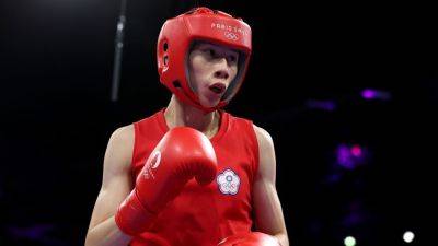 Boxer Lin Yu-ting clinches medal amid Olympics gender dispute - ESPN