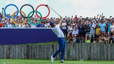 American Scheffler wins men's golf gold