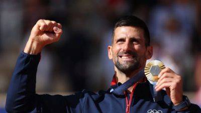 Carlos Alcaraz - Roland Garros - Djokovic fights off Alcaraz to finally strike gold - channelnewsasia.com - Spain - Serbia