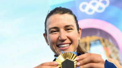 Marianne Vos - Lotte Kopecky - Former venture capitalist Faulkner wins gold in Paris road race poker game - channelnewsasia.com - Belgium - Netherlands - Usa - Hungary - New York - San Francisco