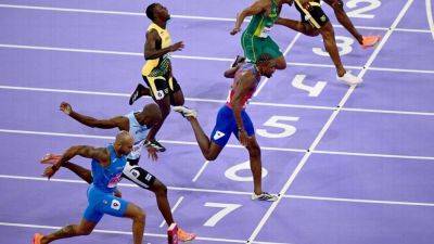 Noah Lyles - Noah Lyles wins gold for U.S. in 100m by 0.005 of a second - ESPN - espn.com - Britain - France - Usa - Jamaica