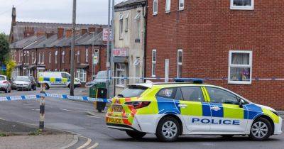 Police cordon in place on Tameside street with officers on scene