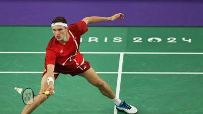 Badminton-Denmark's Axelsen beats Thailand to the men's singles gold