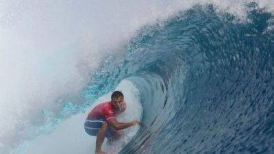 Surfing-Vaast of France wins Olympic surfing gold in Tahiti