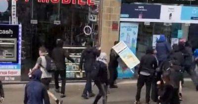 Footage of yobs smashing up vape shop during protests in Manchester city centre