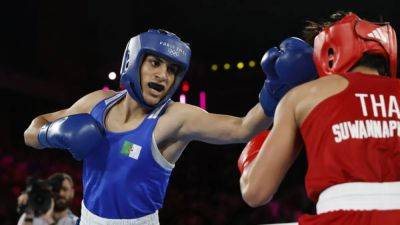 Algerian Khelif wins semi-final amid gender row