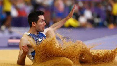 Greek Tentoglou retains long jump title to emulate Lewis