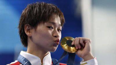 Chinese diver Quan Hongchan's thoughts turn to food after winning 10m platform gold