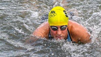 Olympic triathlete who fell ill after swim in Seine says virus made her sick, not E. coli