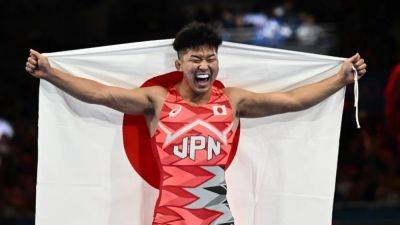 Wrestling-Japan's Kusaka wins 77kg Greco-Roman gold, Iran's Saravi claims 97kg title