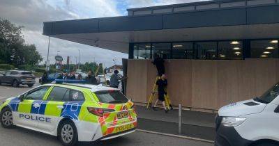 Aldi windows boarded up as amid fears of disorder across Greater Manchester