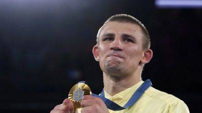 Ukraine's Khyzhniak wins middleweight gold