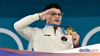 Rizki Juniansyah Pecah Telur Medali Emas Olimpiade Angkat Besi