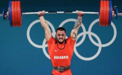 'Man From Mars' Karlos Nasar Wins Olympic Weightlifting Gold With New World Record