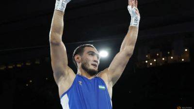 Uzbekistan's Mullojonov wins men's heavyweight gold