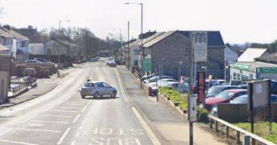 BMW smashes into a bus stop and wall after being 'forced off the road' by van driver