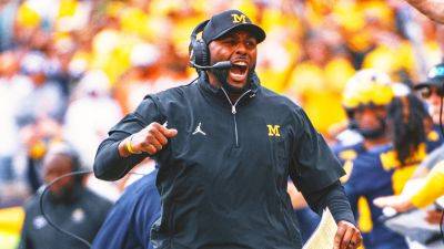 Michigan coach Sherrone Moore signs full contract, nearly 9 months after initial agreement