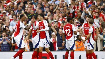 Depleted Arsenal head to Spurs hoping to keep pace with title rivals