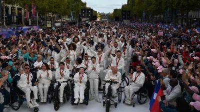 Emmanuel Macron - Paris Olympics - Paris Games - Leon Marchand - France throws one last party for Paris Olympics, Paralympics with parade on Champs-Élysées - cbc.ca - France