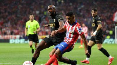 Atletico cruise to 3-0 win over struggling Valencia