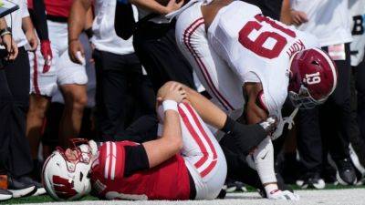 Sources - Wisconsin QB Tyler Van Dyke has torn ACL - ESPN