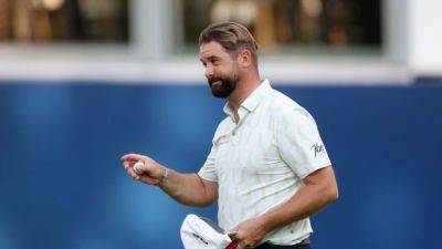 Baldwin leads BMW PGA Championship, McIlroy snaps club